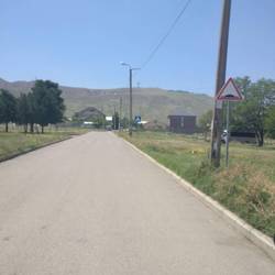 Kingdom Hall on right in distance (w/ blue square logo)