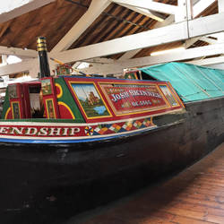The cabin is in the stern of the boat.