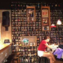 Kristin preparing for an upcoming exam while i neatly stacked all my empties on shelves beside her