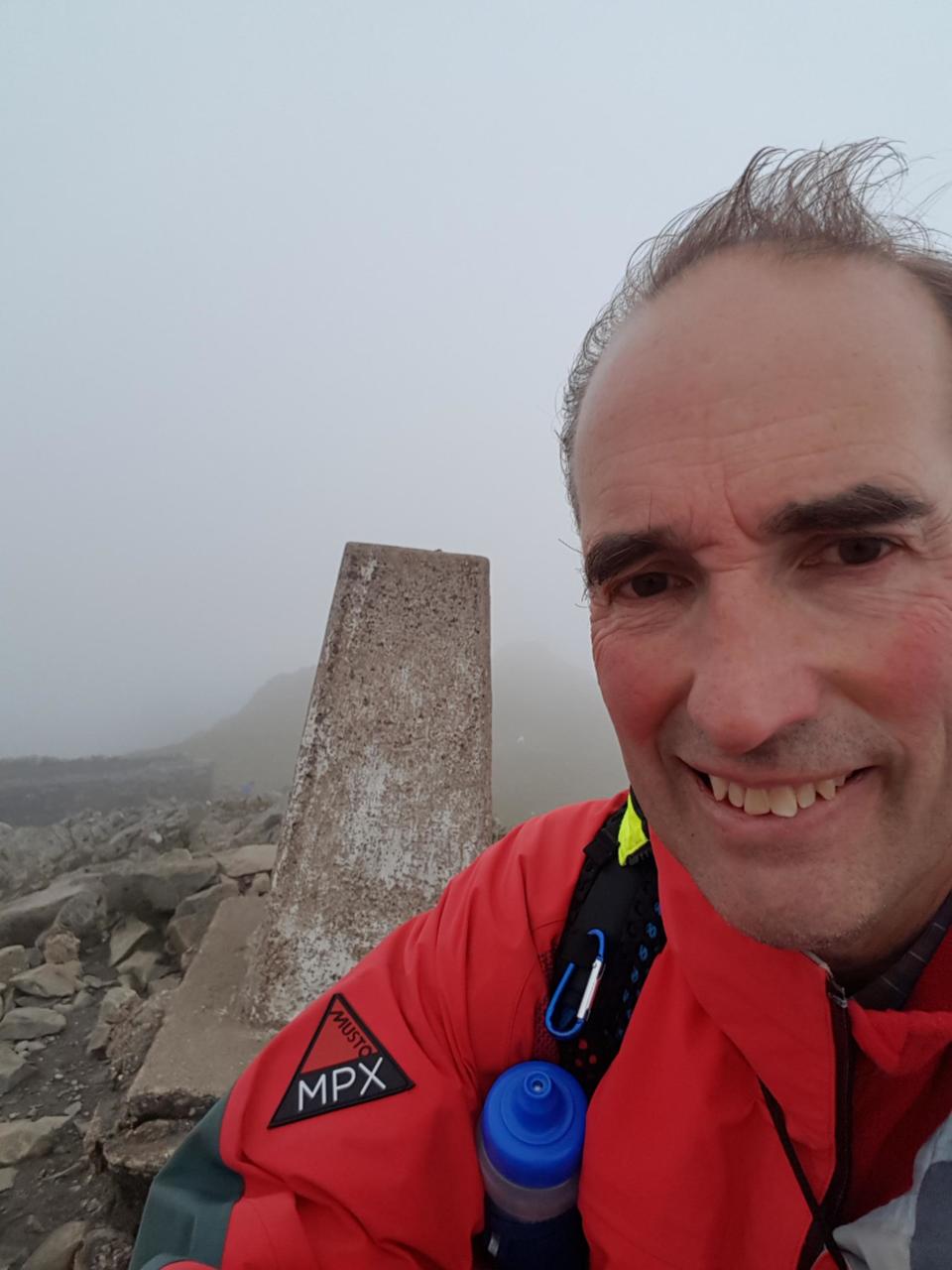 Cader Idris trig point with shelter in background