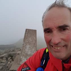 Cader Idris trig point with shelter in background