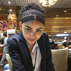 My waitress, freshly coiffed in a New Year's hairstyle,a custom with Ethiopian women