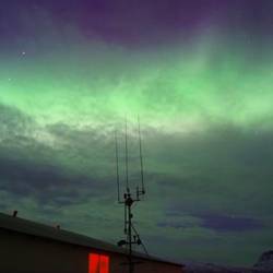 Turning the my left to see the aurora being spiked by the antennas of a boat. *