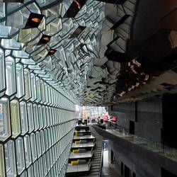 The ceiling is covered with angled mirrors.