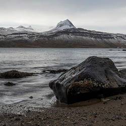 Rock on the shore of Reykjarfjord with Djupavik on the distant shore to right of the rock.