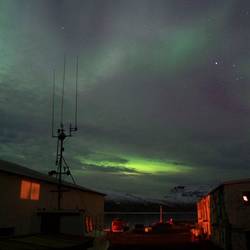 Cloudy sky blocks much of the aurora, Djupavik.