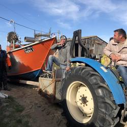 Boat pulled up by tractor