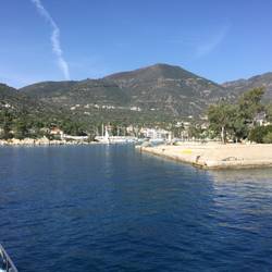 Methana harbour water to left all smokey from sulphur