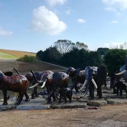 A herd of recycled metal elephants