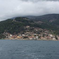 Nafpaktos from the sea with castle at top and walls faning out left and right