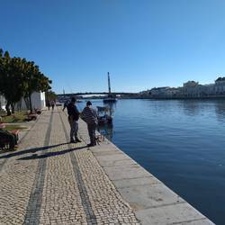 Fishermen and dredging boat.