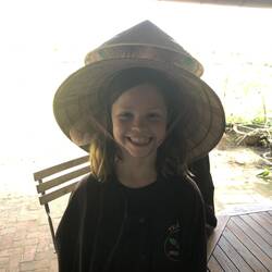 Dale is sporting a Vietnamese farmer outfit.