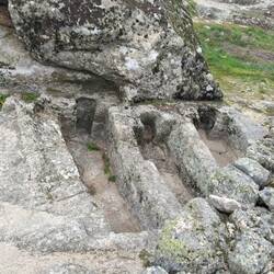 1,000 year old 'coffins' carved into the granite