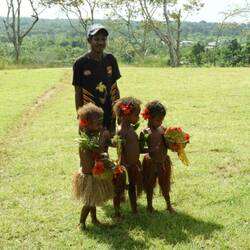 Sweet little children welcoming the influx of tourists