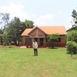 The guide in front of his house
