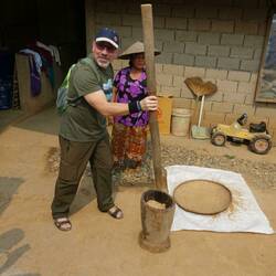 Pounding rice to remove the husks