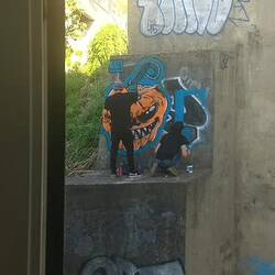 Grafitti being painted right outside our dining room window. Two storey's up!