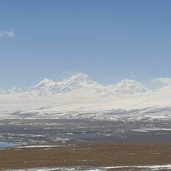 Snow capped mountains line the lake