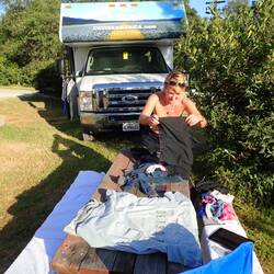 Jackie should really wear a top when she's doing the laundry