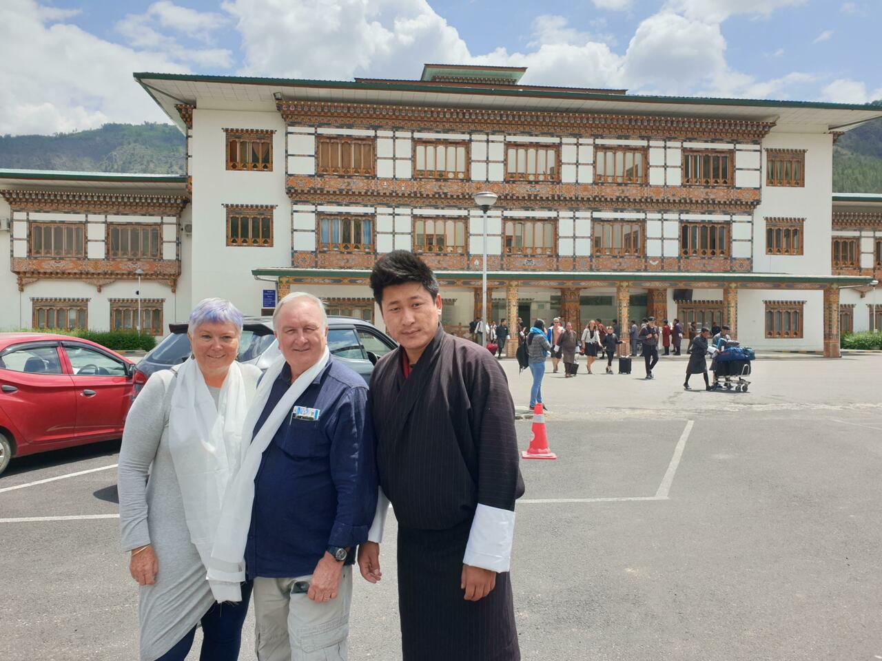 Our guide greets us at the airport with a traditional gift of a white scarf