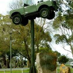 Landrover up a pole in Keith