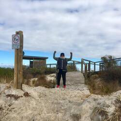 Kay happy to reach the beach at the end of the boardwalk