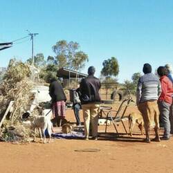 Staff yarning to Arlparra locals