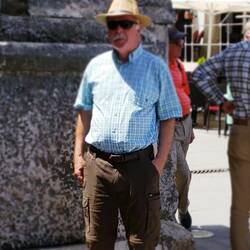 A local mafioso? The hat was to save his bald head from the hot sun, but I like it.