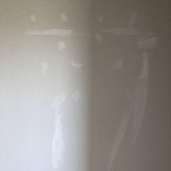 Sidney's way to clean up marks n the wall.