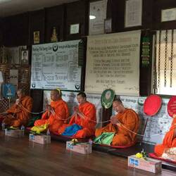 Monk's chanting and praying in Mac's school