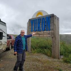 Russ at the Yukon sign