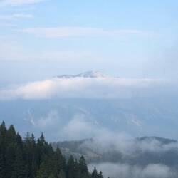 Another peak appearing out of the clouds