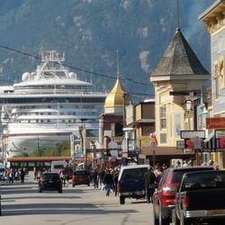 The cruise ships berthed at the end of the main street.