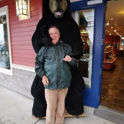 A grizzly old fellow pictured with a bear!