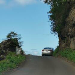The mountain road was very narrow with twisting turns all the way