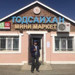 Our guide NK at a shop. Note the Russian script.