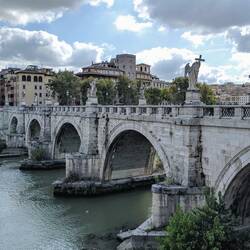 The Bridge of Angels (Ponte Sant'Angelo) is decorated with massive angel sculptures.