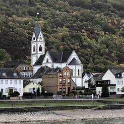 Pretty towns with churches line the banks of the Rhine