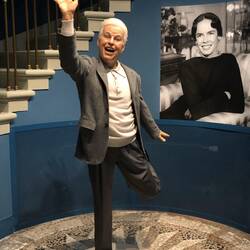 Charlie Chaplin in his later years - his wife Oona behind him