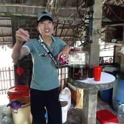 Tim the tour guide with herbal rice wine (Alc 40%)