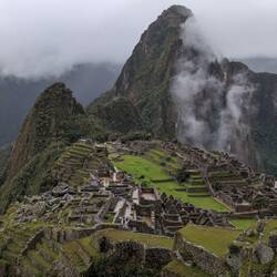 Machu Picchu city is nestled between 2 mountains: Huayna Picchu (larger) and Machu Picchu