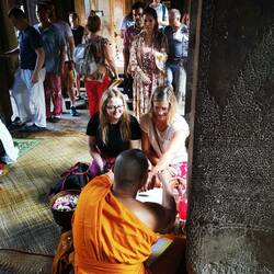 Stephanie and Lucy receiving a blessing
