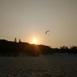 Air glider at sunset
