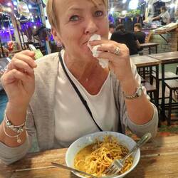 Enjoying a bowl of Chiang Mai Noodles