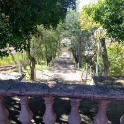 The last 100 steps up to the cross. Can you see the town below?