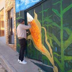 Street artist in the alley of murals