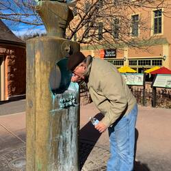 Mui tasting the spring water that once had visitors flocking to Manitou Springs.