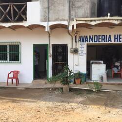 The new bakery to the left of the laundry, with the red chair.