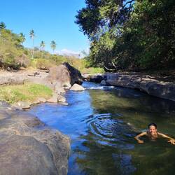 Swimming in a hot spring waterfall