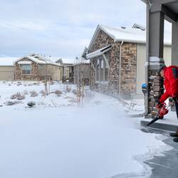 Before he starts to shovel, Mui goes at the snow with a leaf blower — Colorado Springs, CO.